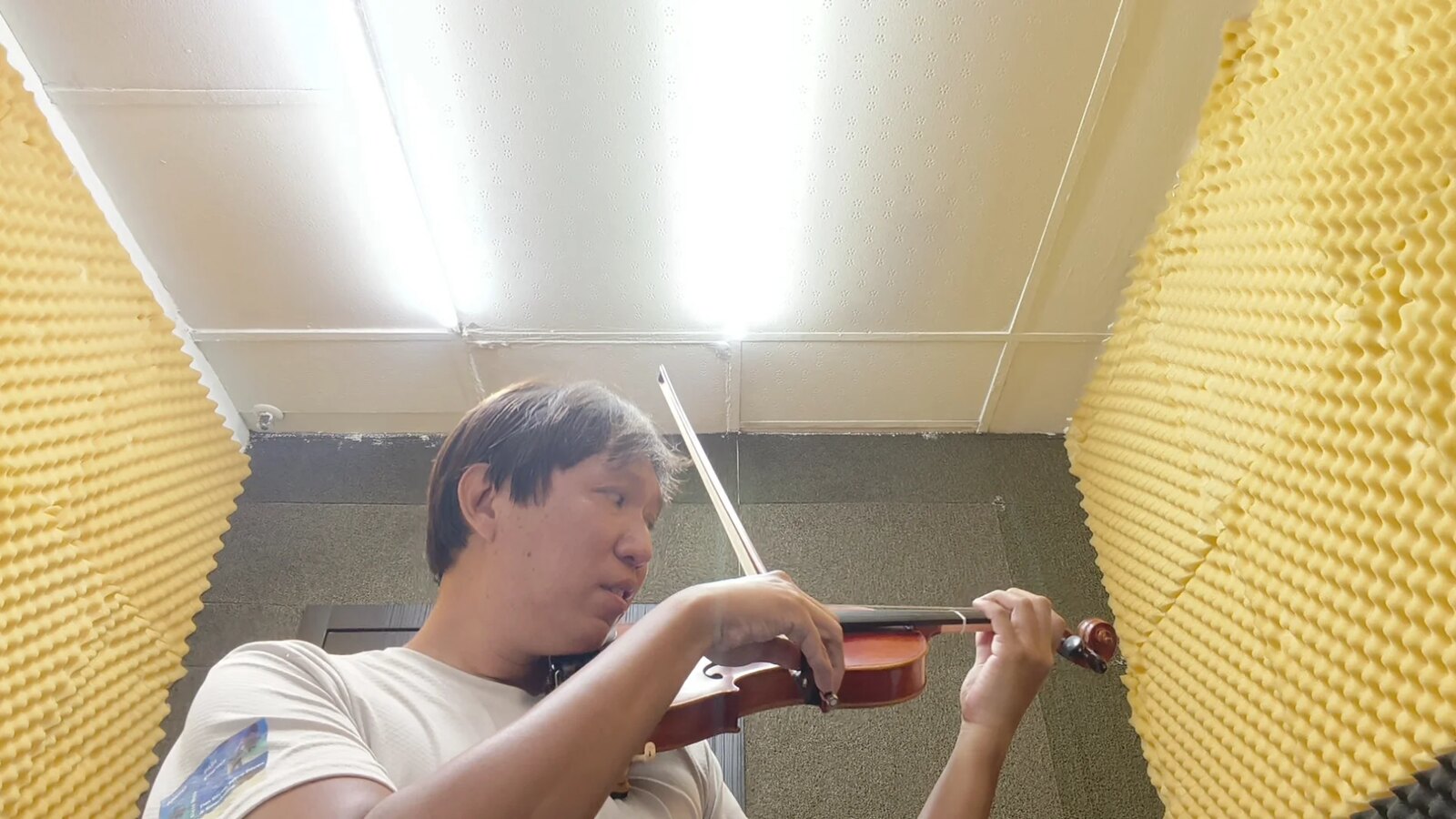 Practising the violin in a sound-treated practice room